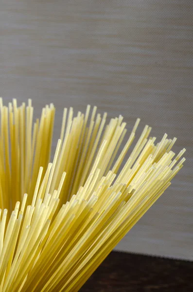 Spaghetti Beige Background Bunch Spaghetti Close Group Dry Spaghetti Unprepared — Stock Photo, Image