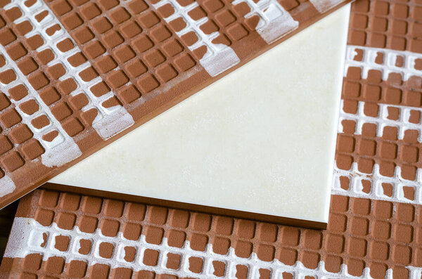 Ceramic tile close-up. A detailed shot of three ceramic tiles. Front and Back of ceramic tiles for walls. Building materials. Selective focus.