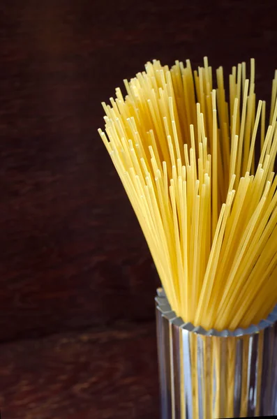 Spaghetti Glass Cup Brown Wooden Table Bunch Spaghetti Close Group — Stock Photo, Image