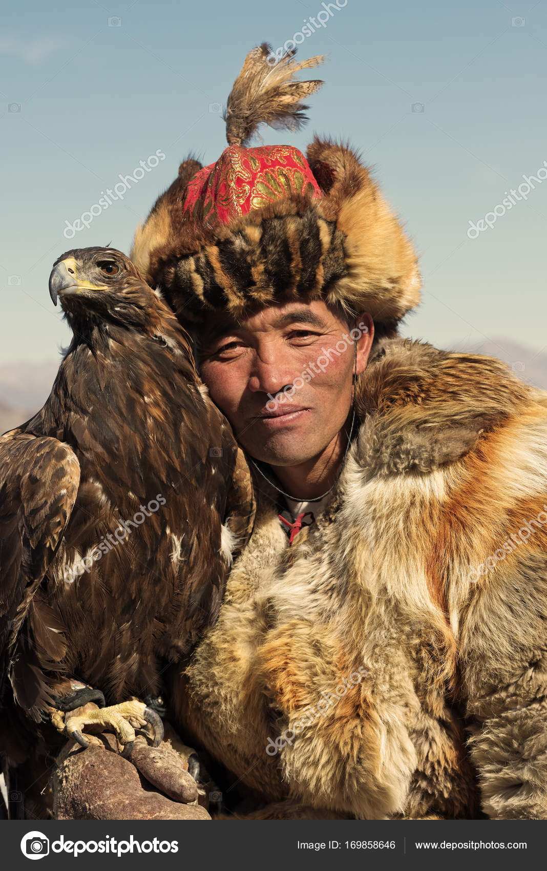 Unknown Huntsman Shows His Golden Eagle That Is Trained For