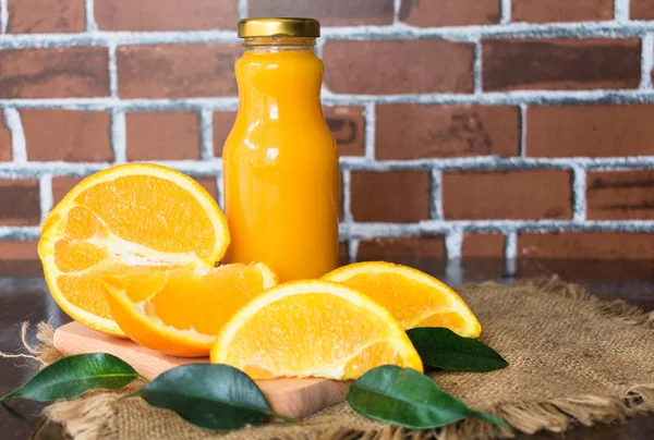 Orange Juice Bottle Brick Wall Background — Stock Photo, Image