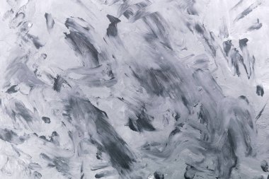 Grunge tarzında bir arka plan. Duvardaki fırça darbelerinin gri dokusu, tuval..