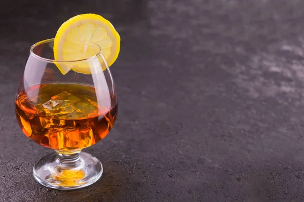 Glass Cognac Lemon Slices Isolated Black Background Copy Space — Stock Photo, Image