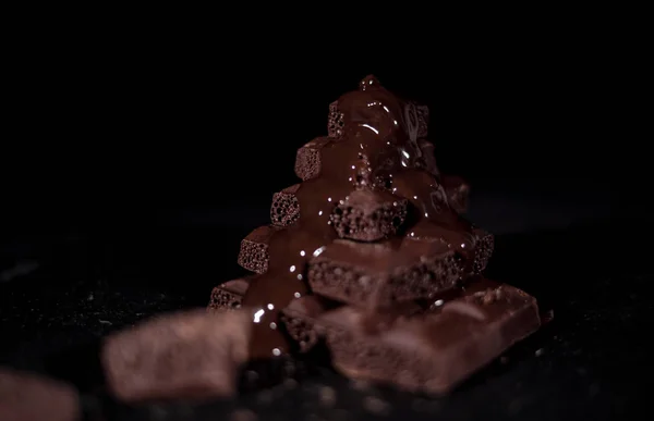 Stack of black pore chocolate — Stock Photo, Image