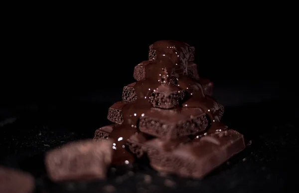 Stack of black pore chocolate — Stock Photo, Image