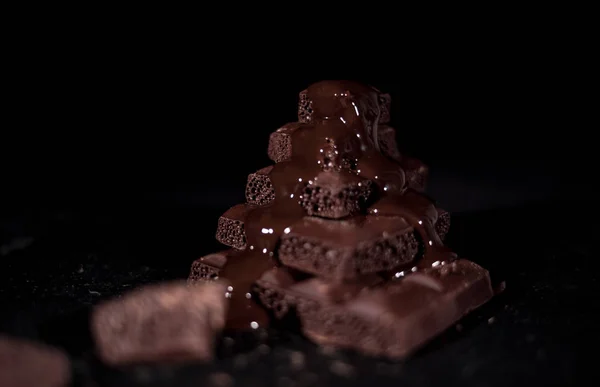 Stack of black pore chocolate — Stock Photo, Image