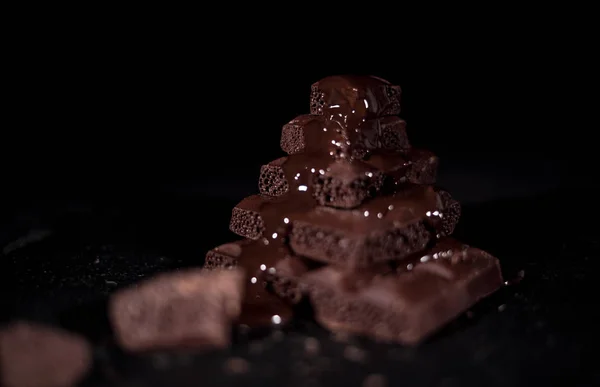 Stack of black pore chocolate — Stock Photo, Image