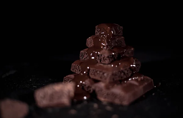 Stack of black pore chocolate — Stock Photo, Image