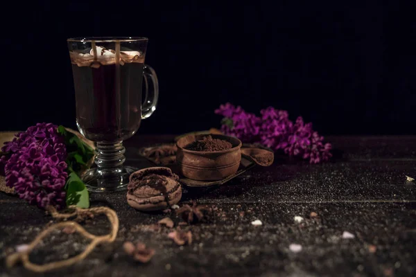 Hot chocolate (cocoa) in a glass mug.