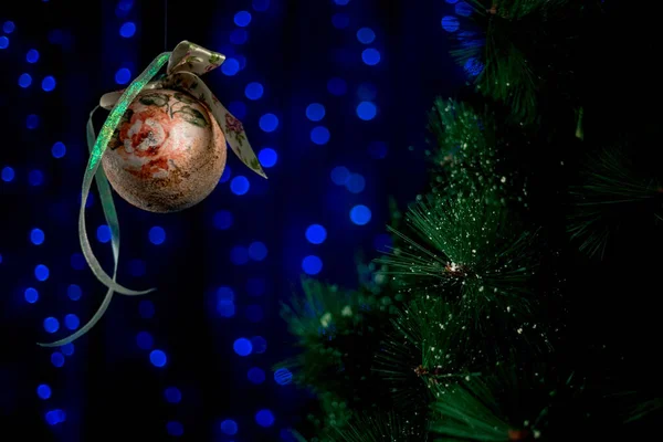 homemade vintage Christmas ball rolling in the air near NewYears Tree.