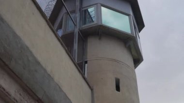 prison observation tower, view from below in cloudy weather