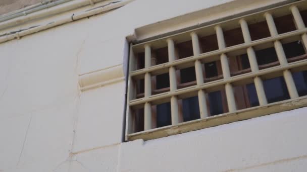 Prison cell window with metal bars, close up. outside view — Stock Video