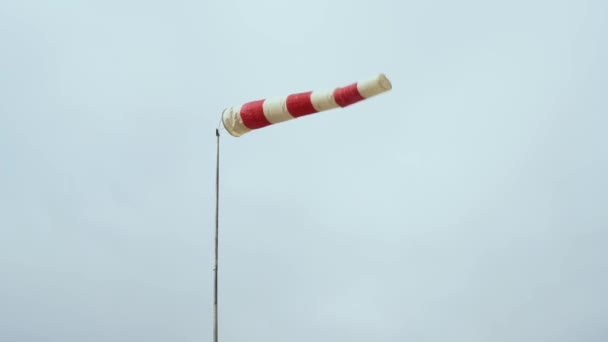 Cone Windsocker. Horizontally flying windsock wind vane due to high wind. — Stock Video