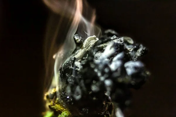 Macro close up of a smoking smouldering marijuana bud. — Stock Photo, Image