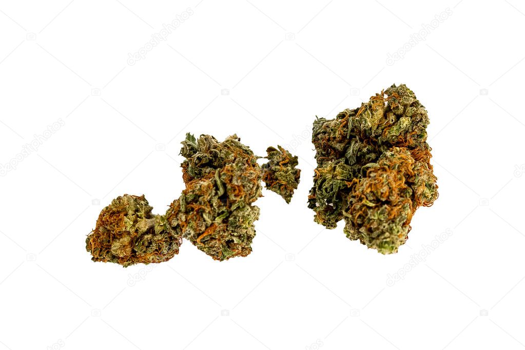 A small pile of vibrant marijuana buds infront of a white backgr