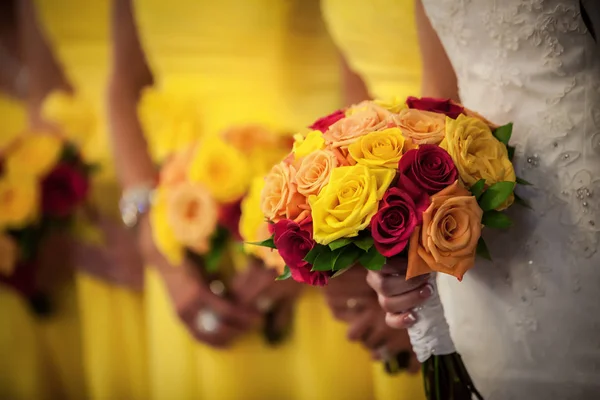 Bride Holding Bouquet with Bridesmaids in Background — Stock Photo, Image