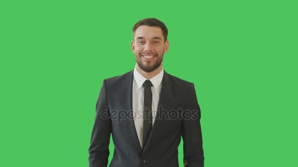 Medium Shot of a Handsome Businessman in a Tailored Suit Crossing Arms on His Chest and Soring Warmly (em inglês). Tiro em um fundo de tela verde . — Vídeo de Stock