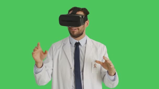 Mid Shot of a Scientist Wearing VR Headset in Wonderment Gesticulating with Raised Hands. Shot with Green Screen Background. — Stock Video