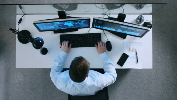 Top View of Information Technology Specialist Working With International Servers and Internet Traffic. It's Early Morning and He Drinks Coffee. — Stock Video