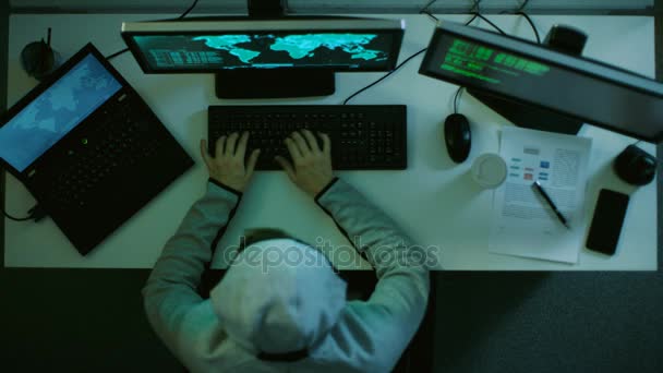 Top View of a Hacker Breaking into International Datacenter. He Uses Self Made Malicious Software. — Stock Video