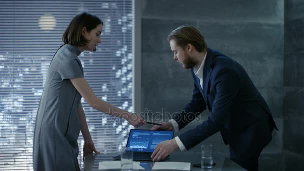 In a Modern Private Office Young Male and Female Successful Start-up Partners Discuss Important Documents. Office Has Window with Big City View. — Stock Video