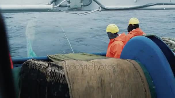 Team of Fishermen Unwind the Trawl Net during Commercial Fishing — Stock Video