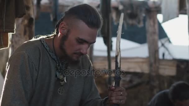 Portrait of Dressed in Medieval Clothing Man Working with Wood. Life of Civilian People at the Village. Medieval Reenactment. — Stock Video