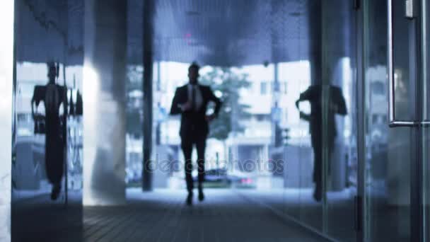 Businessman Running on Streets of Business District. Slow Motion Shot. — Stock Video