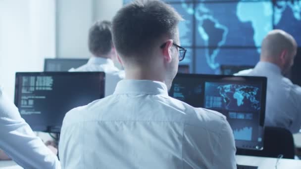 Team IT Security Professional Working in Bright Monitoring Room Filled with Displays — Stock Video