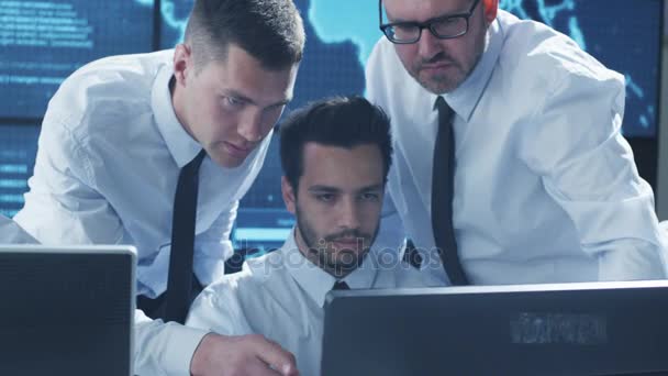 Team IT Security Professional Working in Bright Monitoring Room Filled with Displays — Stock Video