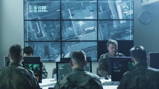 Group of Military IT Professionals on Briefing in Monitoring Room Filled with Displays on Military Base — Stock Video