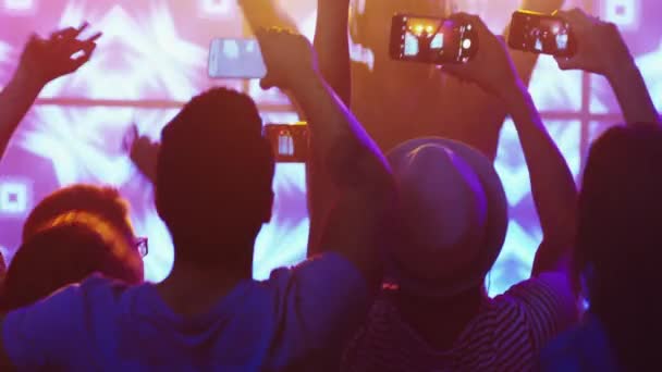 DJ Playing Music in Nightclub, People Dancing, Recording the Concert with Mobile Phones. — Stock Video