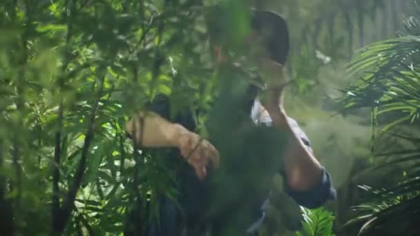 Adventurer in Hat using Talking on Mobile Phone in Jungle Forest. — Stock Video