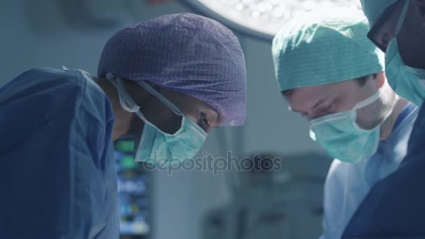 Medical Team Performing Surgical Operation in Modern Operating Room — Stock Video