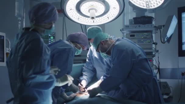 Medical Team Performing Surgical Operation in Modern Operating Room — Stock Video