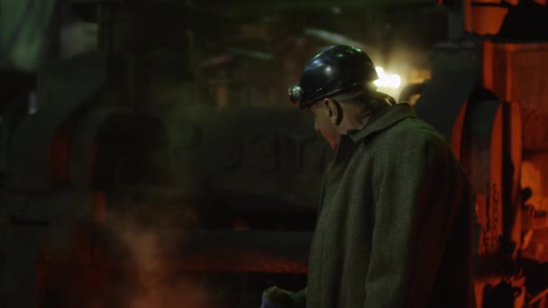 Heavy Industry Worker Doing Quality Control in Foundry. Rough Industrial Environment. Wide Shot. — Stock Video