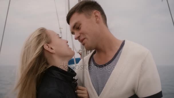 Young couple having romantic time on a sailing boat in the sea. — Stock Video