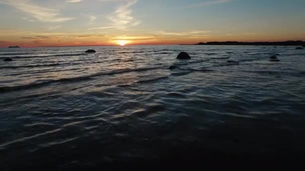 Aerial drone shot of the coast and sea at sunset. — Stock Video