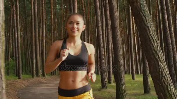 Young Girl is Running in Forest at Morning Time — Stock Video