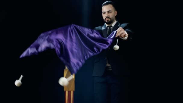 Professional Magician Performs Flying Table Illusion. Looks Spectacular. Shot on a Black Background. — Stock Video