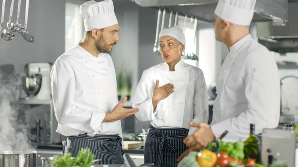 In the Modern Kitchen Team of Cooks Have Discussion. Kitchen is — Stock Photo, Image