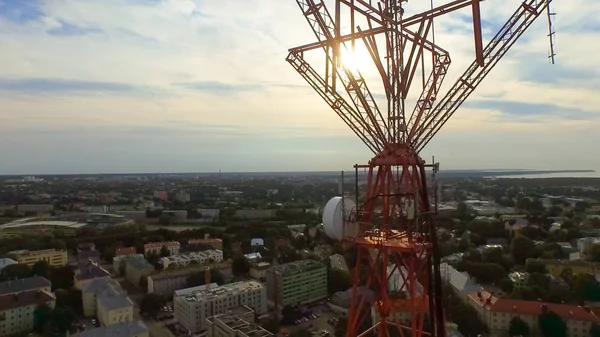 Aerial drone shot of a telecommunication radio tower mast in res