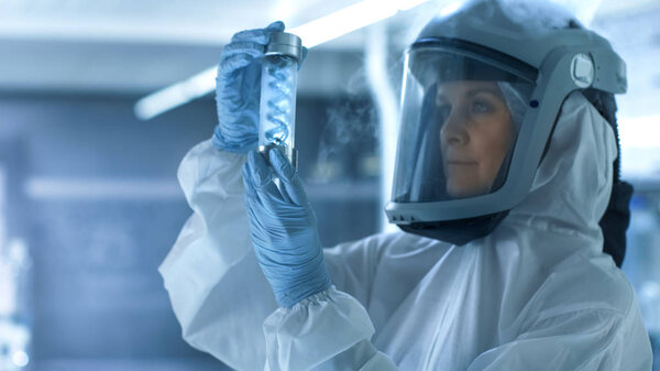 Medical Virology Research Scientist Works in a Hazmat Suit with 