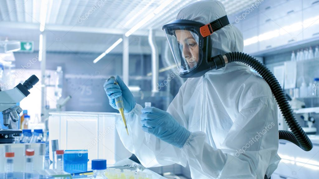 Medical Virology Research Scientist Works in a Hazmat Suit with 
