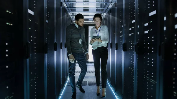 Male and Female Server Technicians Working in Data Center. Runni — Stock Photo, Image