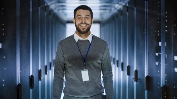 Portrait of an IT Engineer, he Smiles and Folds His Arms on a Ch — Stok Foto