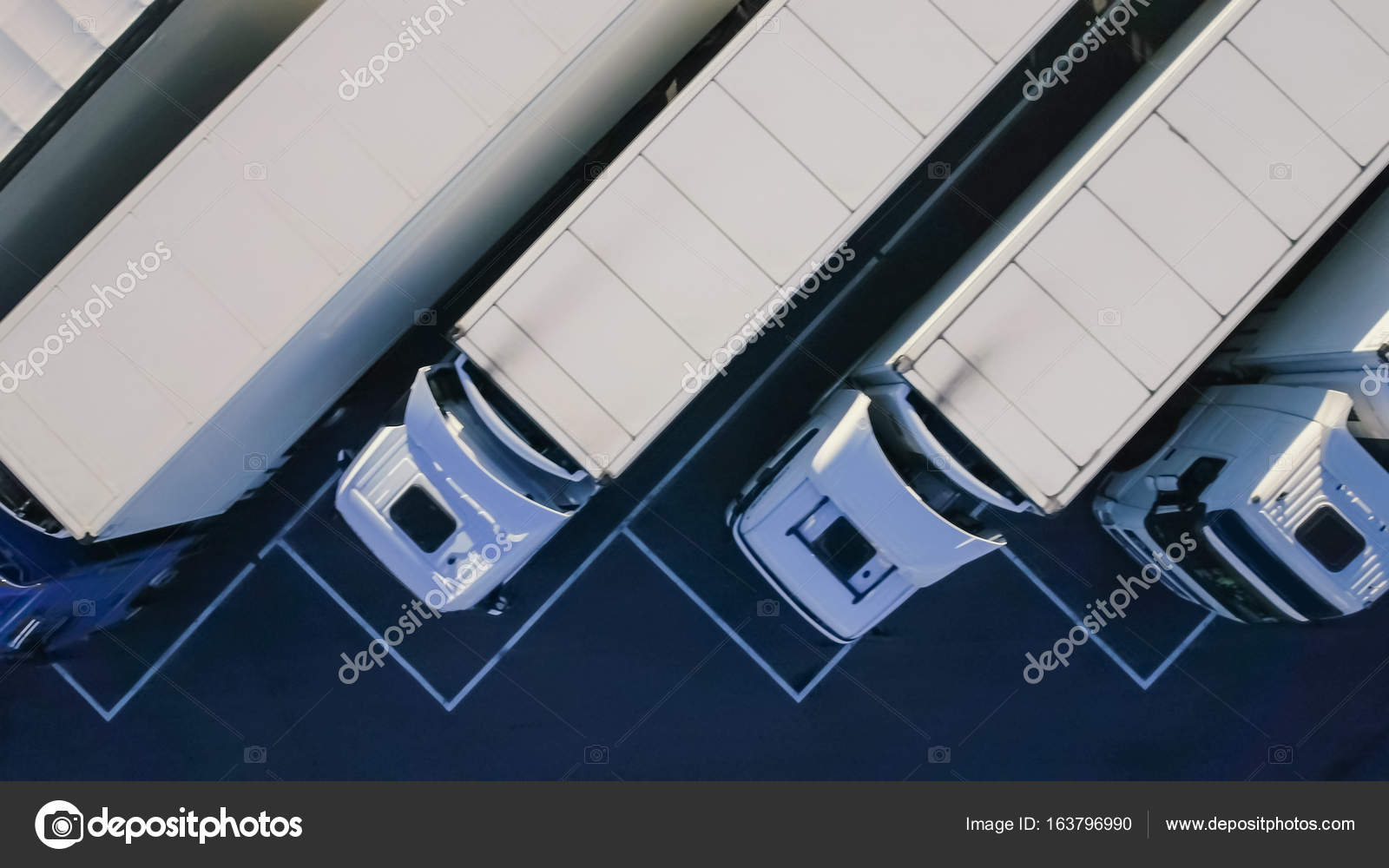Aerial Top View of White Semi Truck with Cargo Trailer Parking with