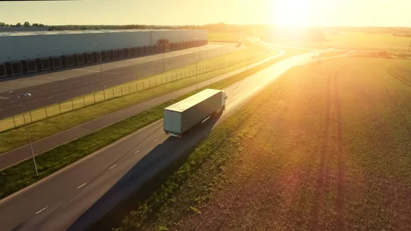 Aerial Shot of White Semi Truck with Cargo Trailer Attached Movi