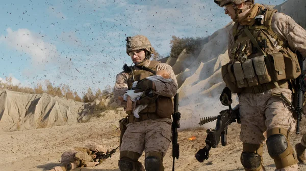 Soldier Carrying a Baby and Running Away from the Explosion Whil — Stock Photo, Image