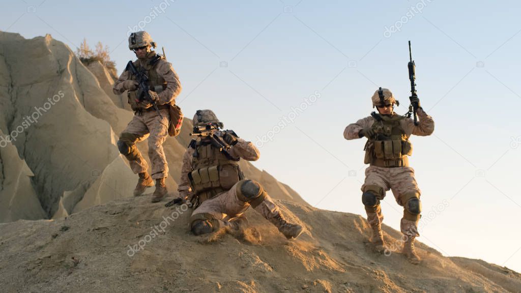 Group of Fully Equipped and Armed Soldiers Moving Down the Hill 